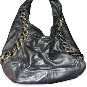 Michael Kors Black leather slouchy shoulder bag with gold chain detailing.